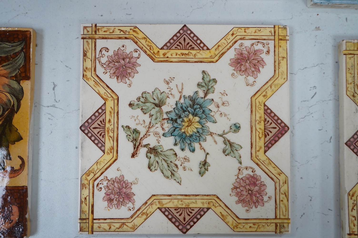 John Moyr Smith, a set of eight Waverley series Minton picture tiles to include Rob Roy and Old Mortality together with other floral tiles, largest 20 x 20cm. Condition - mostly fair, some cracked